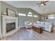 Comfortable living room featuring a fireplace, vaulted ceilings, and hardwood floors at 855 Queensgate Dr, Greenwood, IN 46143