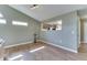 Open living room with vaulted ceiling, a view to the kitchen, and modern lighting at 855 Queensgate Dr, Greenwood, IN 46143