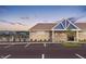 Exterior view of the community center featuring brick facade, a parking lot, and landscaping at 8727 Duncan St, Fortville, IN 46040