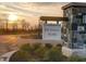 Community entrance sign at Mt Vernon North at sunset featuring brick pillars and well-maintained landscaping at 8727 Duncan St, Fortville, IN 46040