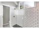 Bathroom featuring white subway tile and a shower with black tiled floor at 8807 Wintergreen Way, Indianapolis, IN 46256