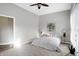 Bright bedroom with a neutral color palette, carpet and ceiling fan at 8807 Wintergreen Way, Indianapolis, IN 46256