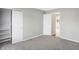 Bright bedroom with closet and view of the hallway at 8807 Wintergreen Way, Indianapolis, IN 46256