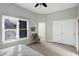 Bedroom showcasing large closet doors, carpet, neutral colors and natural light at 8807 Wintergreen Way, Indianapolis, IN 46256