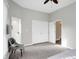 Bedroom view showcasing neutral colors, closet space and doorway to bathroom at 8807 Wintergreen Way, Indianapolis, IN 46256