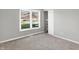 Bedroom featuring a window with blinds, closet, and neutral decor at 8807 Wintergreen Way, Indianapolis, IN 46256