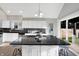 Stylish kitchen with white cabinets, granite counters, and a view of the backyard at 8807 Wintergreen Way, Indianapolis, IN 46256