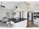 Bright kitchen features an island with bar seating and stainless steel appliances at 8807 Wintergreen Way, Indianapolis, IN 46256
