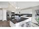 Modern kitchen with stainless appliances, white cabinets, and granite countertops at 8807 Wintergreen Way, Indianapolis, IN 46256
