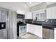 Efficient kitchen with stainless appliances and ample counter space at 8807 Wintergreen Way, Indianapolis, IN 46256