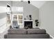 Comfortable living room showcasing vaulted ceilings, fireplace, and floor to ceiling windows at 8807 Wintergreen Way, Indianapolis, IN 46256