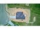 An aerial view of the gray roof, concrete driveway, and surrounding new construction at 9182 Mulligan Ct, Elwood, IN 46036