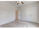 Neutral bedroom featuring a ceiling fan, door, and neutral carpeting at 9182 Mulligan Ct, Elwood, IN 46036