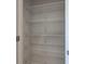 Empty closet featuring several rows of wire shelving at 9182 Mulligan Ct, Elwood, IN 46036