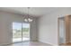 Dining area featuring a sliding glass door and light wood floors at 9182 Mulligan Ct, Elwood, IN 46036