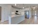 Bright, modern kitchen featuring an island, stainless steel appliances, and white cabinetry at 9182 Mulligan Ct, Elwood, IN 46036