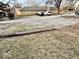 Gravel backyard and parking area, with utility pole visible at 921 W Carson St, Muncie, IN 47303