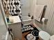 Bathroom with a smiley face shower curtain and patterned floor tiles at 921 W Carson St, Muncie, IN 47303