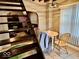 Dining room with a round table and view of the living room under the stairs at 921 W Carson St, Muncie, IN 47303
