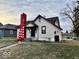 Charming home featuring a unique chimney design and classic architectural details at 921 W Carson St, Muncie, IN 47303