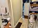 Hallway Bathroom with patterned tile flooring and a rack with towels at 921 W Carson St, Muncie, IN 47303