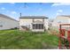 Beautiful backyard with a brick patio, garden, and screened-in porch at 10221 Tournon Dr, Fishers, IN 46037