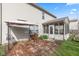 Lovely brick patio area next to a screened-in porch in backyard at 10221 Tournon Dr, Fishers, IN 46037