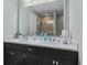 This bathroom offers double sinks and a large mirror at 10221 Tournon Dr, Fishers, IN 46037