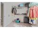 Spacious walk-in closet with ample shelving, providing generous storage for clothing and personal items at 10221 Tournon Dr, Fishers, IN 46037