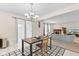 Dining room adjacent to the living area with table and chair at 10221 Tournon Dr, Fishers, IN 46037