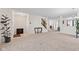 Bright foyer leading to open living spaces, showcasing neutral decor and a welcoming atmosphere at 10221 Tournon Dr, Fishers, IN 46037