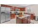 Well-lit kitchen features stainless steel appliances and granite countertops at 10221 Tournon Dr, Fishers, IN 46037