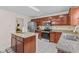 Updated kitchen boasts stainless steel appliances and granite countertops at 10221 Tournon Dr, Fishers, IN 46037