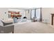 Open-concept living space connecting to the kitchen, featuring neutral carpet and ample seating for gatherings at 10221 Tournon Dr, Fishers, IN 46037