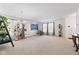 Open-concept living room with neutral carpet, abundant natural light, and elegant decor, perfect for entertaining at 10221 Tournon Dr, Fishers, IN 46037