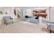 Bright and airy living room with easy access to the kitchen and staircase, showcasing a functional layout at 10221 Tournon Dr, Fishers, IN 46037