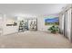 Spacious living room filled with natural light, neutral carpet, and soothing ambiance, creating a relaxing space at 10221 Tournon Dr, Fishers, IN 46037
