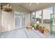 Relaxing sunroom with plants, tile floor, and natural light at 10221 Tournon Dr, Fishers, IN 46037