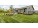 Well-maintained backyard with patio, dining set, and privacy fence, offering a serene outdoor space at 1024 Cyprian Way, Lebanon, IN 46052