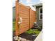 Wooden privacy fence with a garden and fountain enhances the charm and tranquility of the backyard at 1024 Cyprian Way, Lebanon, IN 46052