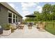 Outdoor living space with a patio, modern furniture, and a manicured backyard at 1024 Cyprian Way, Lebanon, IN 46052