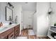 Bathroom featuring double sinks, a modern mirror, and updated fixtures at 1024 Cyprian Way, Lebanon, IN 46052