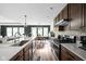 Well-equipped kitchen with gas range, island sink, and seamless flow into the dining area at 1024 Cyprian Way, Lebanon, IN 46052