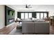 Spacious living room with fireplace, TV, windows, and access to dining and kitchen areas at 1024 Cyprian Way, Lebanon, IN 46052