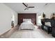The main bedroom boasts a decorative accent wall, fireplace, and plenty of natural light at 1024 Cyprian Way, Lebanon, IN 46052