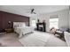 A spacious main bedroom with large windows, a stylish fireplace, and modern decor at 1024 Cyprian Way, Lebanon, IN 46052