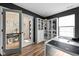 Stylish home office with built-in shelves, a large desk, and views to the hall at 1024 Cyprian Way, Lebanon, IN 46052