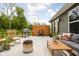 Well-appointed patio with wicker seating, grill, fire pit, and plush sofa, perfect for entertaining at 1024 Cyprian Way, Lebanon, IN 46052