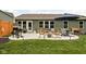 Relaxing patio with comfortable seating, grill, and fire pit, perfect for outdoor entertaining at 1024 Cyprian Way, Lebanon, IN 46052
