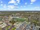 An aerial view of the neighborhood showcasing a park, commercial district, and residential buildings at 1025 E 60Th St, Indianapolis, IN 46220